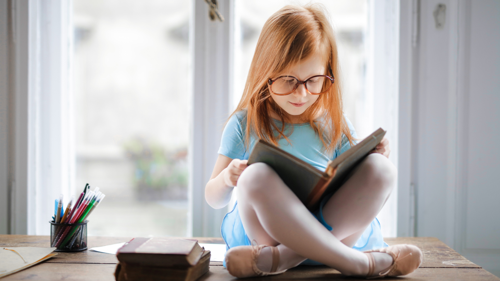 A young girl reading a book 